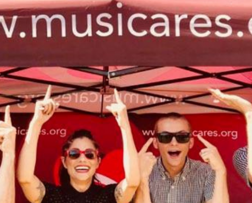 Musicares.org banner being pointed to by team